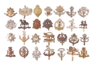 A group of British infantry cap badges
