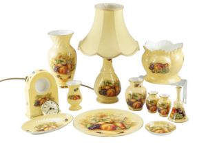 A group of Aynsley Orchard Gold ceramics, including a clock, vases, a cache-pot, a lamp, etc, lamp