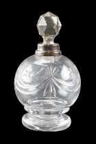 An Edwardian silver mounted cut glass perfume bottle, decorated with stars and swags, London,