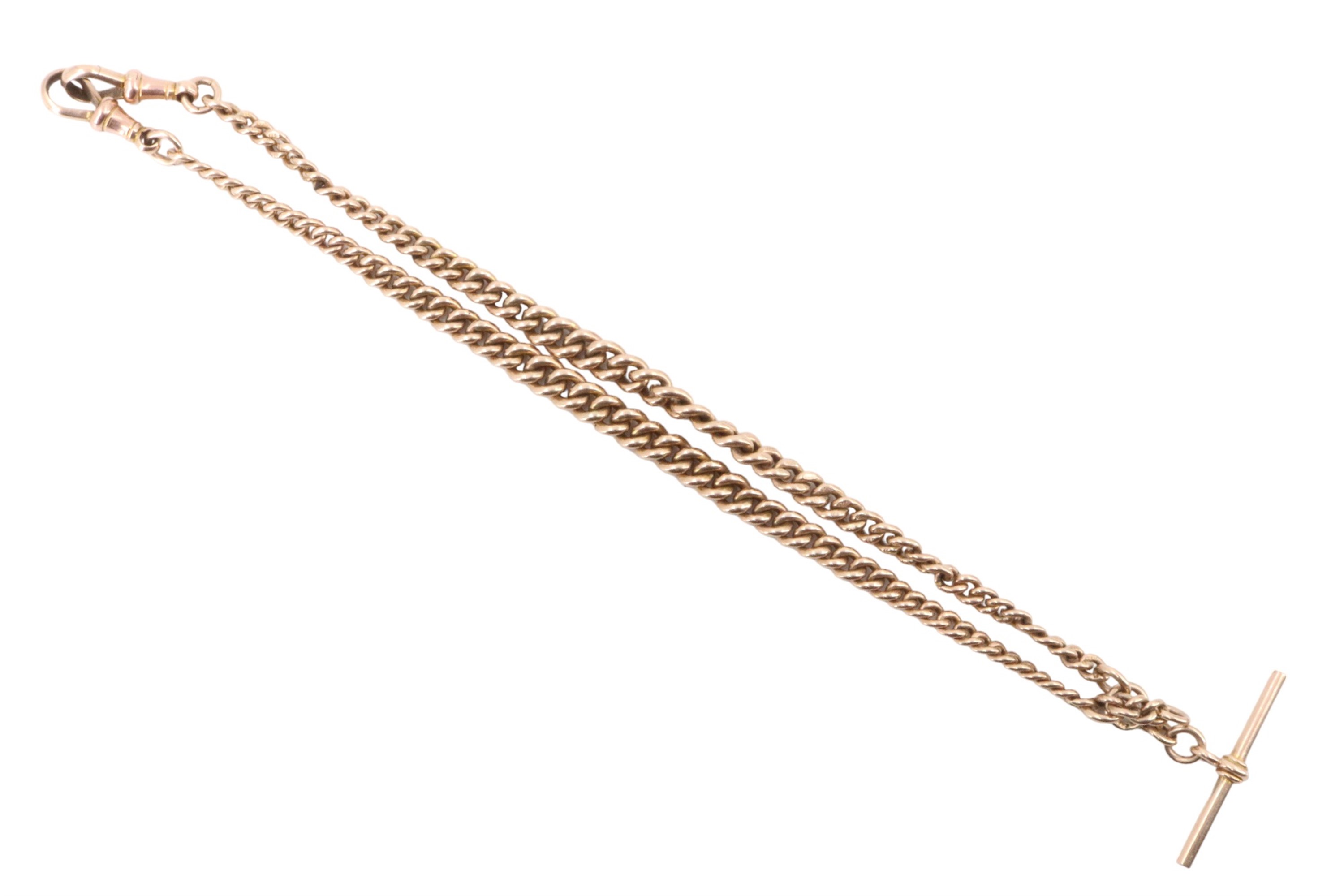 An antique 9 ct gold double watch chain of graded curb links with T-bar and swivels, 38 cm, 34 g