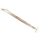 An antique 9 ct gold double watch chain of graded curb links with T-bar and swivels, 38 cm, 34 g