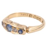 A George V sapphire and diamond finger ring, having a central 3 mm sapphire between two eight cut