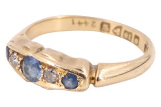 A George V sapphire and diamond finger ring, having a central 3 mm sapphire between two eight cut
