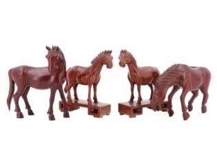 Four Chinese carved wood horses, tallest 13 cm