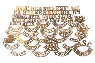 A quantity of brass shoulder titles