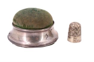 A George V silver collared pin cushion, together with a boxed Dorcas thimble, pin cushion 6.5 cm