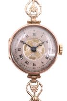 A George V 9 ct gold wristlet watch, having a Swiss movement and a two tone engine turned face, on a