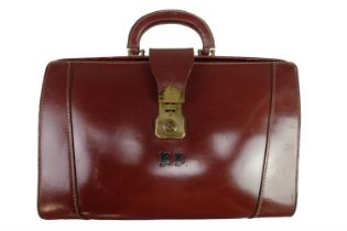 A vintage brown hide briefcase / valise