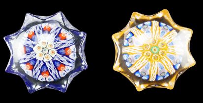 Two star shaped cane paperweights, 6.5 cm x 3 cm