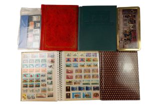 Four albums of GB and world stamps together with two Hong Kong mint stamp packs and a quantity of