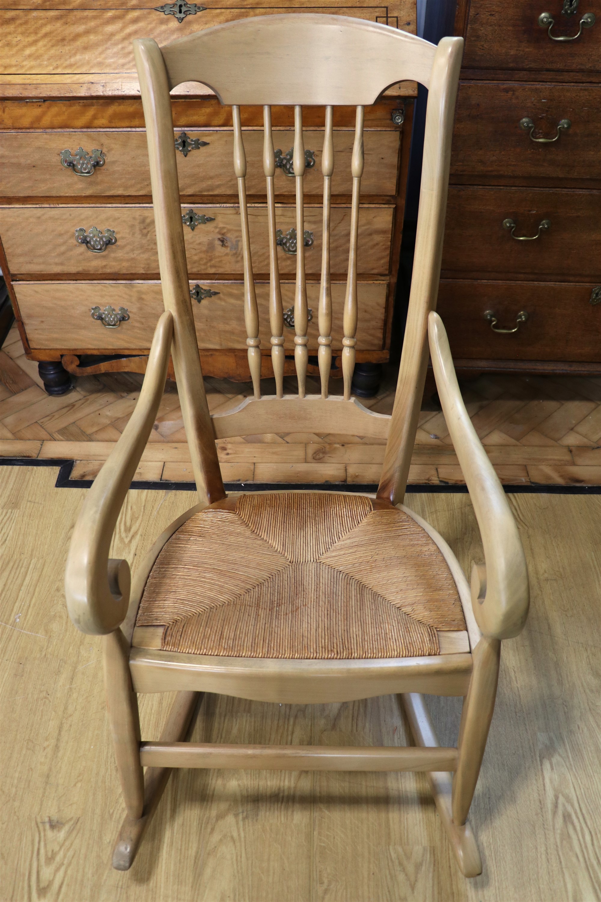A traditional rush seated spindle back rocking armchair, 108 cm - Image 2 of 2