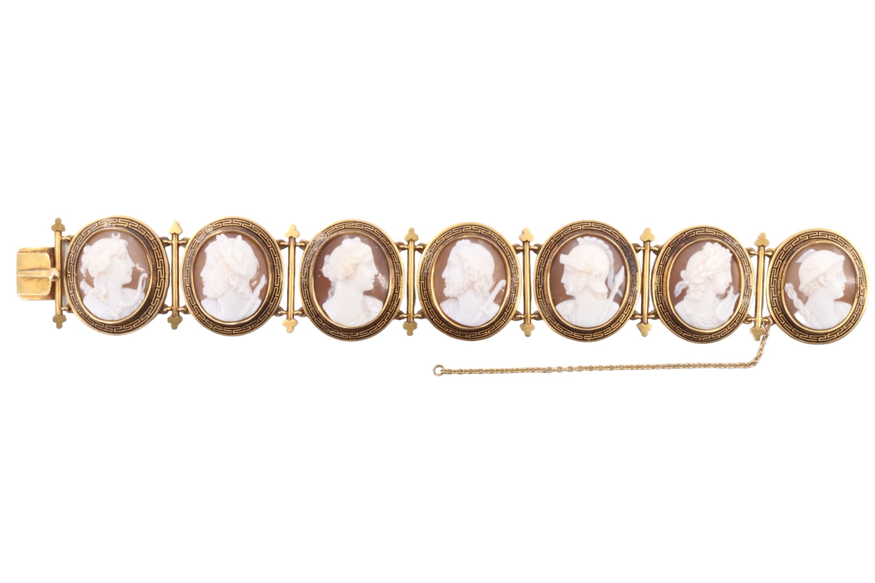 A Victorian shell cameo bracelet, the seven cameos carved in depiction of classical visages, each