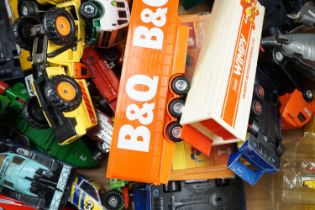 A quantity of largely un-boxed diecast vehicles, together with a boxed Matel 'Littles Hedy' doll,