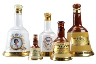 Five various unopened ceramic Bell's whisky decanters, including commemorative