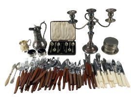 A quantity of electroplate, including a two branch candelabrum, together with a 1960s wooden handled