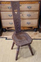 A Scottish carved oak spinning stool, the base stamped 'AB Sutherland, Joiner's House, Haster,
