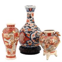 A Japanese Imari lidded porcelain bottle vase together with two Satsuma earthenware vases, early