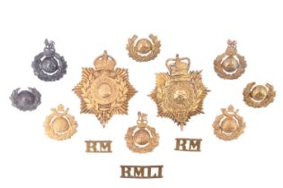 A group of Royal Marines cap and other badges