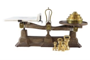 A set of late 19th / early 20th Century Avery cast iron and brass shop counter scales, having a