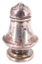 An early 20th Century silver pepperette, of compressed baluster form having a slip fit lid and