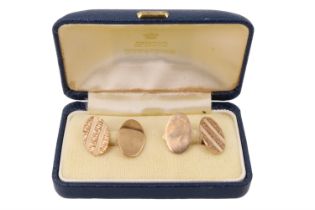A pair of 9 ct gold oval cufflinks, the fronts of each having bark textured bands, 1975, 6.7 g