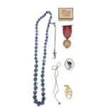 A small group of costume jewellery, including two white-metal neck chains, a chinoiserie bead