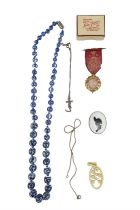 A small group of costume jewellery, including two white-metal neck chains, a chinoiserie bead