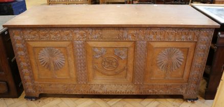 A substantial mid 20th Century elaborately carved African hardwood chest, 173 x 70 x 81 cm