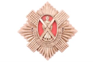 A Second World War Royal Scots plastic cap badge