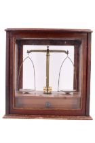A set of mahogany and brass analytical balance scales, comprising a set of freestanding scales