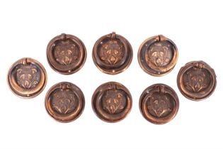 Eight early 20th Century Arts and Crafts influenced copper-anodised furniture ring handles