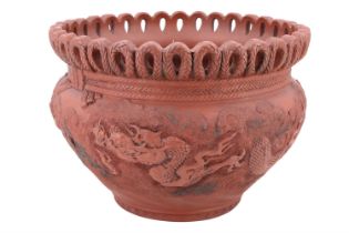 An early 20th Century Chinese red-stoneware dragon pattern planter, 32 x 23 cm