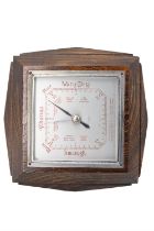 A 1930s elm aneroid barometer, 20 cm