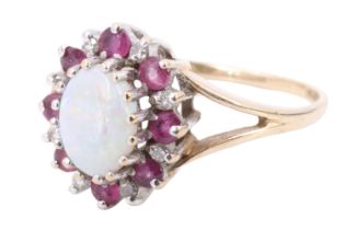 An opal ruby and diamond cluster ring, comprising an oval opal cabochon of approximately 6 mm x 4