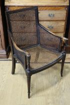 An early 20th Century bergère armchair