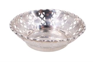 A 1920s silver pierced and reticulated pin dish, having a cusped rim, Harrison Brothers & Howson (