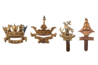 Four Royal Naval Division cap badges