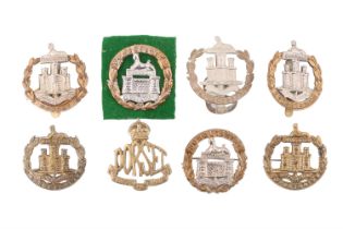A small collection of Dorsetshire Regiment cap badges