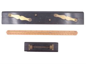 Two early 20th Century ebony parallel rulers, including one marked Sir W G Armstrong Whitworth and