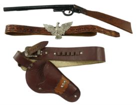 A toy pistol holster together with belt and pop gun, 54 cm