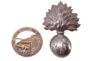 A French Adrian helmet badge together with an "On Ne Passe Pas" badge