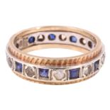 A blue sapphire and white spinel eternity ring, having 11 2 mm square sapphires separated by 11 2 mm