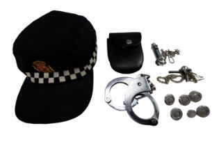 Police collectibles including a set of Hiatts 1960 handcuffs (with keys), a whistle and chain,