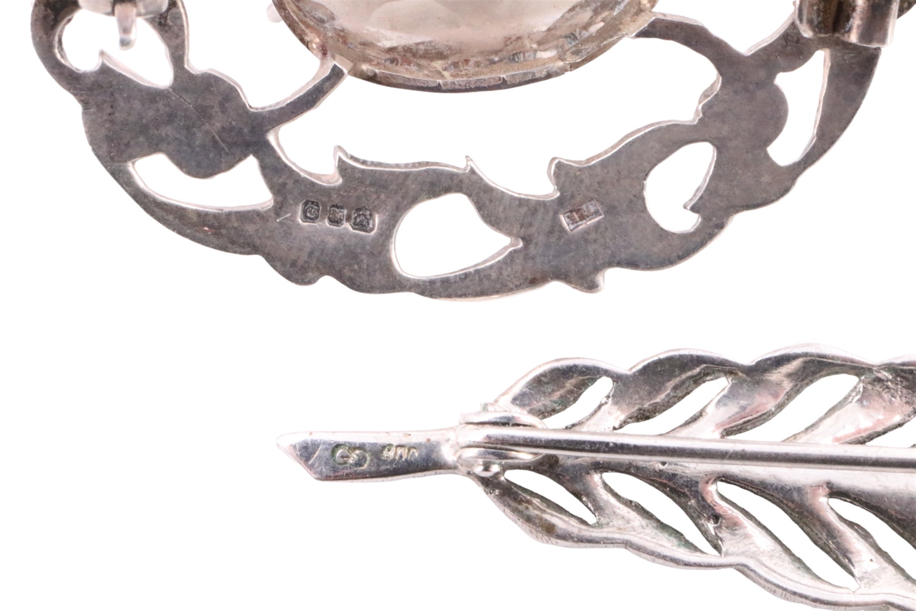 A Scottish silver smoky quartz brooch and a 1970s silver grasshopper pendant, together with three - Image 3 of 3