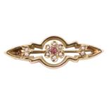 A Victorian pink stone, seed pearl and 9 ct yellow metal brooch, of open geometric form centred by a