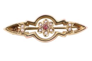 A Victorian pink stone, seed pearl and 9 ct yellow metal brooch, of open geometric form centred by a