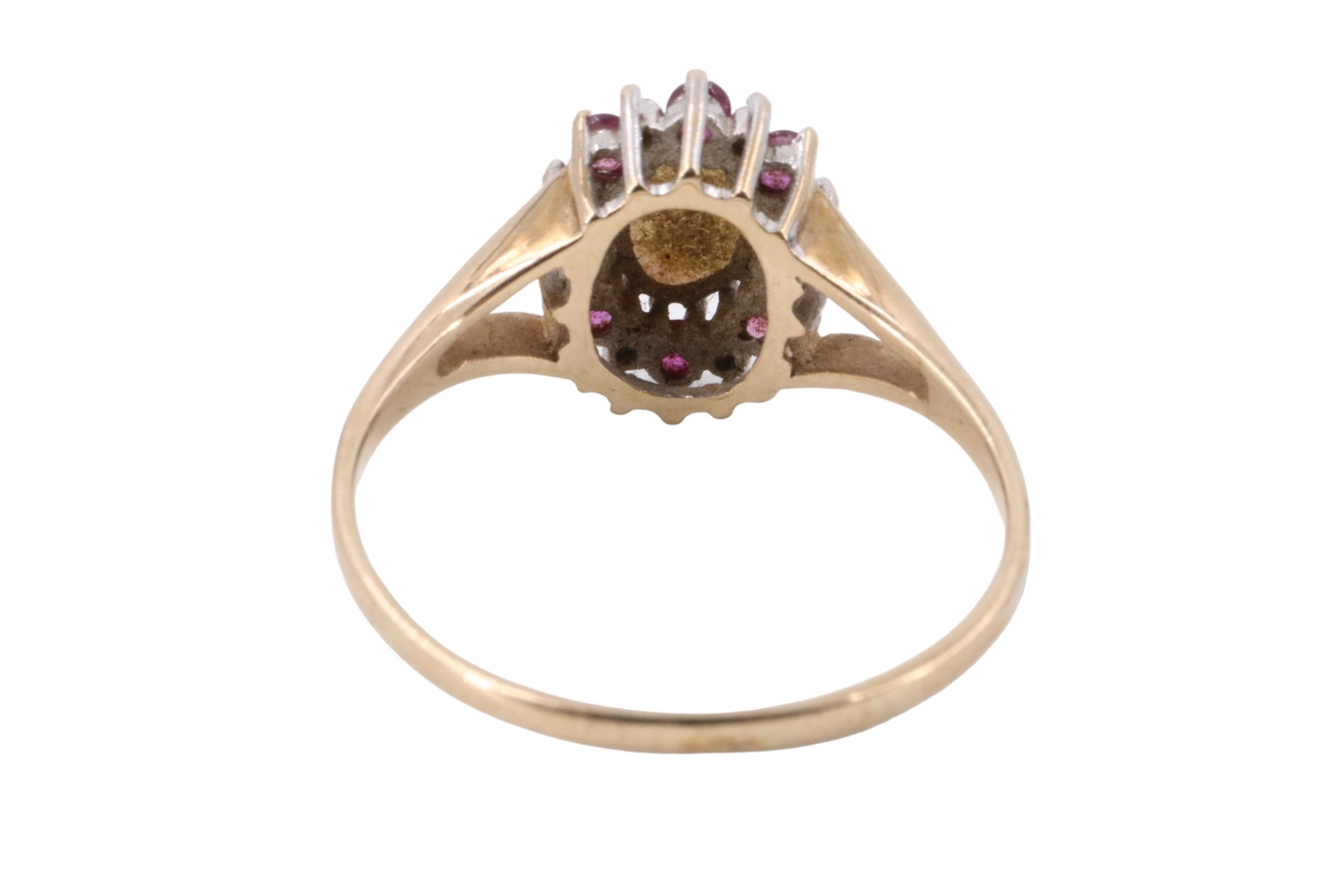 An opal ruby and diamond cluster ring, comprising an oval opal cabochon of approximately 6 mm x 4 - Image 3 of 5