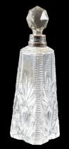 An early 20th Century silver mounted moulded and faceted glass perfume bottle, London, 1910, 17 cm
