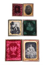 Three Victorian ambrotype photographs respectively portraying two women and a child, two being