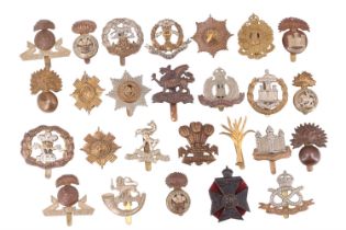 A group of British infantry cap badges